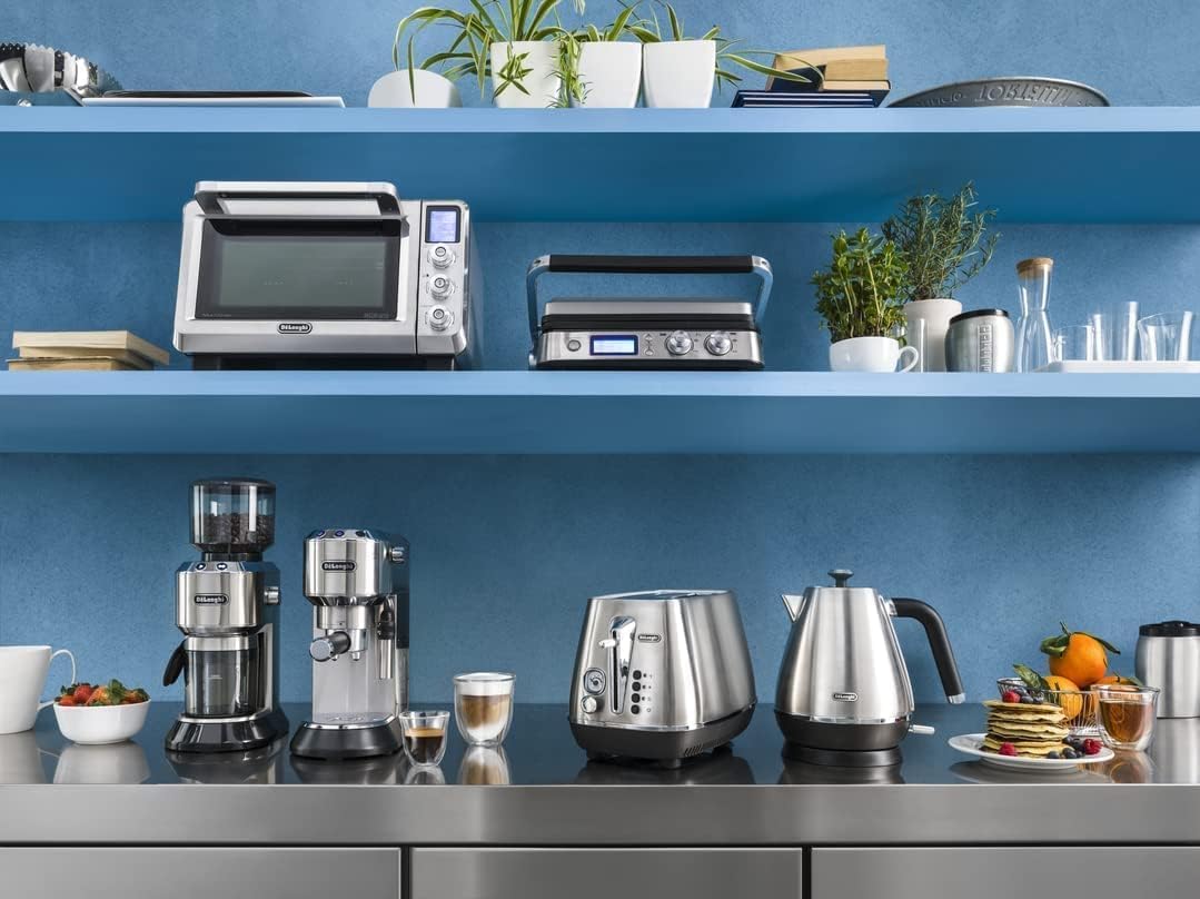 Roll over image to zoom in Delonghi Dedica Coffee Machine, Barista Pump Espresso and Cappuccino Maker, Ground Coffee and ESE Pods can be used, Milk Frother for Latte Macchiato and more, EC685.M, Metallic,